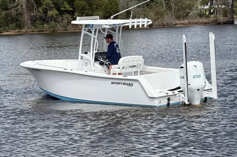Slide: The Image of 2021 Sportsman Heritage 231 Center Console boat on calm water, side view. - 12