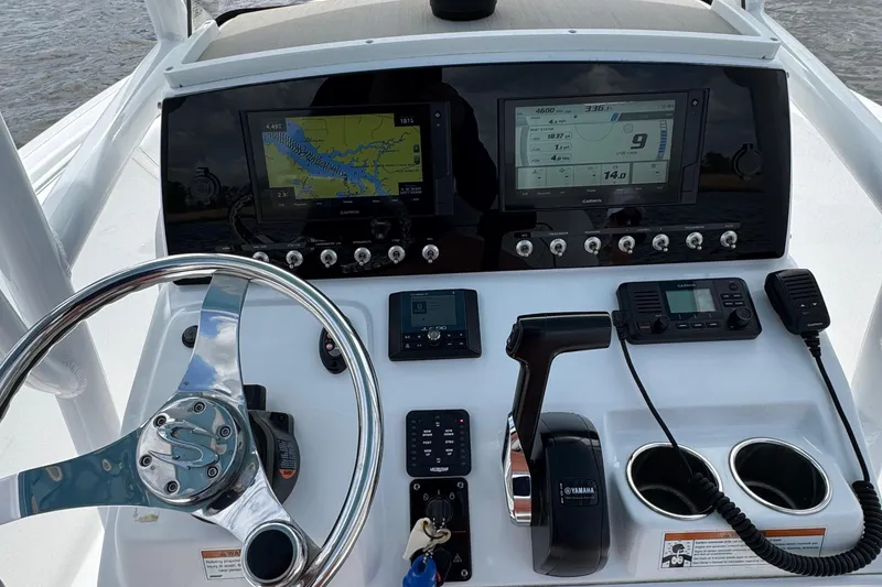 Slide: The Image of 2021 Sportsman Heritage 231 Center Console dashboard with navigation and control systems. - 19