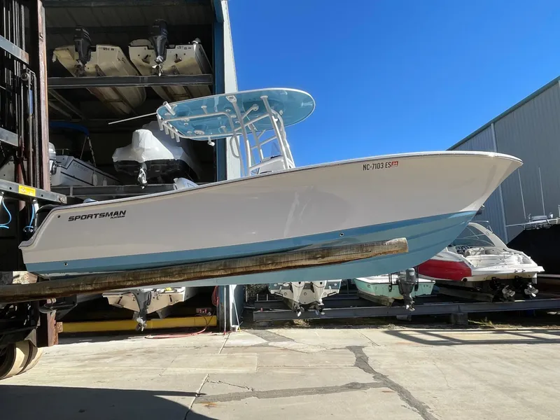 Slide: The Image of 2021 Sportsman Heritage 231 Center Console boat in storage, side view. - 22