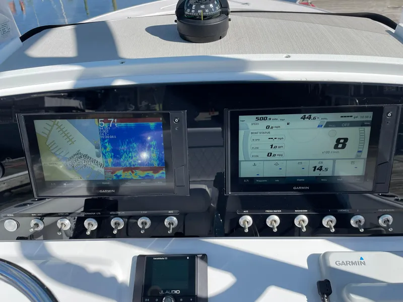 Slide: The Image of Control panel of 2021 Sportsman Heritage 231 Center Console with Garmin displays. - 31