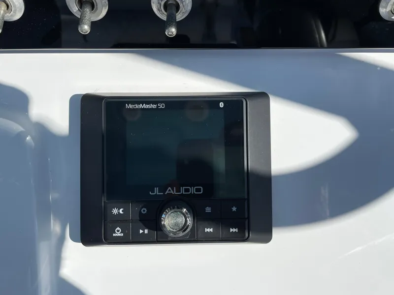 Slide: The Image of JL Audio MediaMaster 50 on 2021 Sportsman Heritage 231 Center Console boat dashboard. - 32