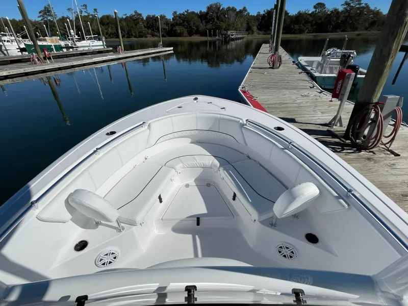 Slide: The Image of 2021 Sportsman Heritage 231 Center Console boat docked at a marina. - 38