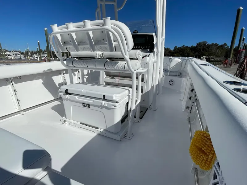 Slide: The Image of 2021 Sportsman Heritage 231 Center Console boat with seating and Yeti cooler on deck. - 41