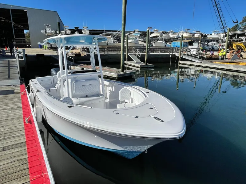 Slide: The Image of 2021 Sportsman Heritage 231 Center Console boat docked at marina. - 42