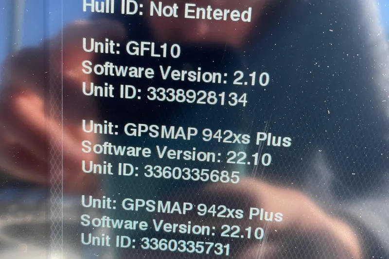 Slide: The Image of 2021 Sportsman Heritage 231 Center Console display showing software versions and unit IDs. - 49