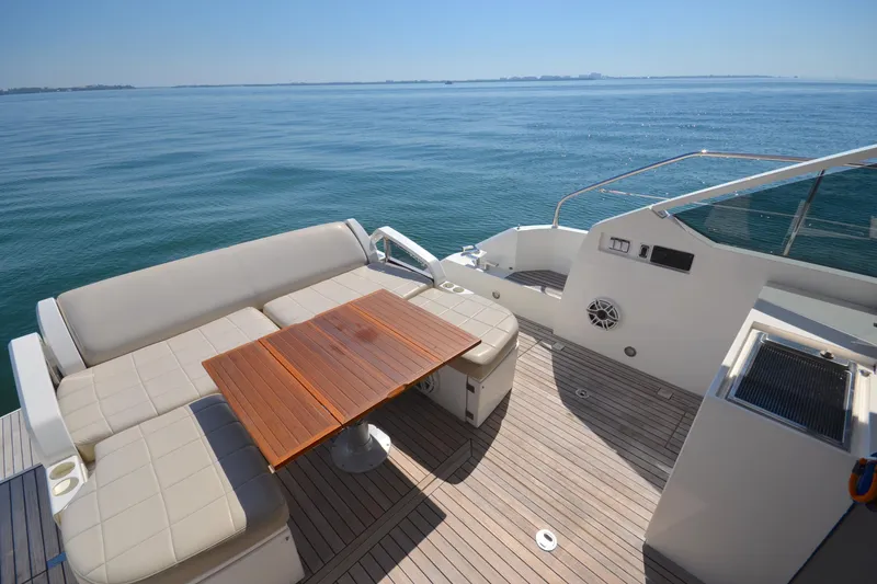 Slide: The Image of Luxurious 2013 Fairline Targa 50 GT yacht deck with seating and ocean view. - 12