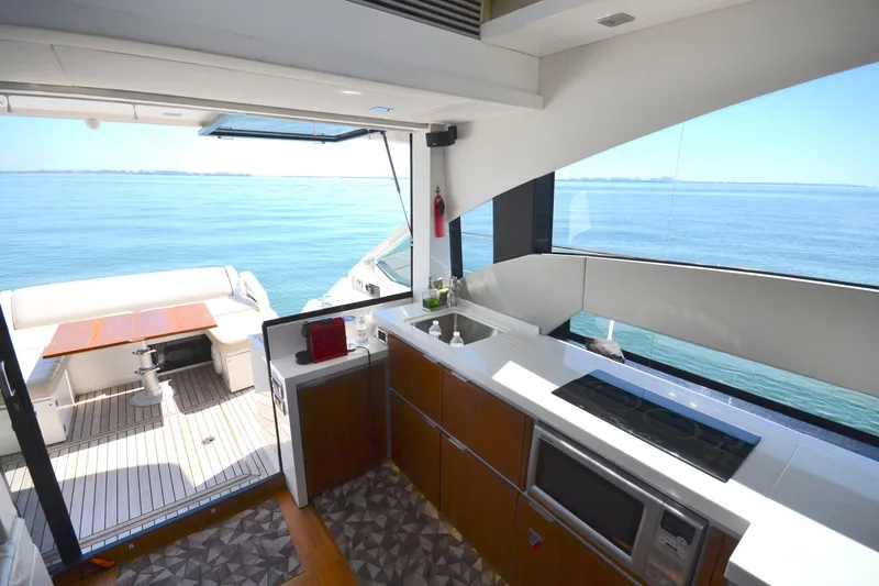 Slide: The Image of Interior view of 2013 Fairline Targa 50 GT yacht with ocean backdrop. - 16