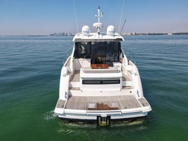 Slide: The Image of 2013 Fairline Targa 50 GT yacht on calm water, rear view. - 8