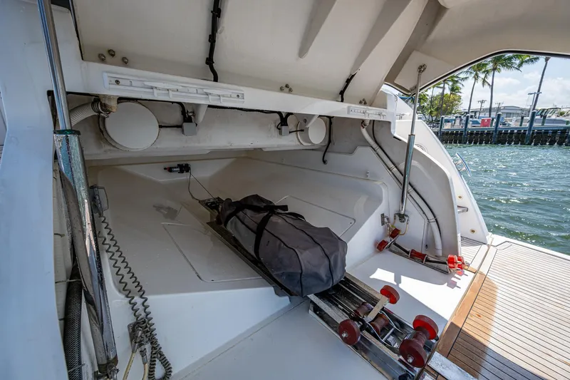 Slide: The Image of 2019 Sunseeker Predator 50 yacht storage compartment with equipment and water view. - 13