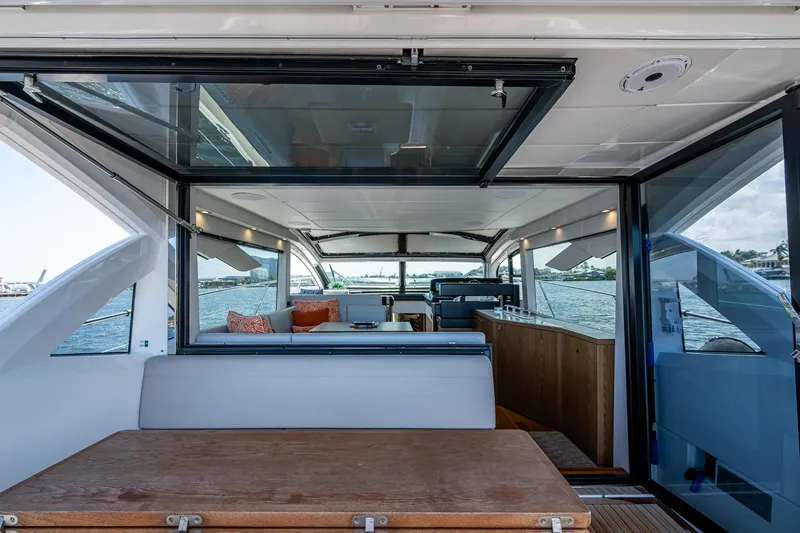 Slide: The Image of 2019 Sunseeker Predator 50 yacht interior with open seating and ocean view. - 26