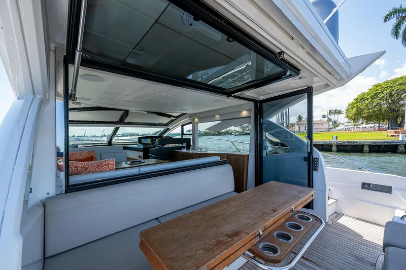 Slide: The Image of 2019 Sunseeker Predator 50 yacht interior with open deck and seating area. - 27