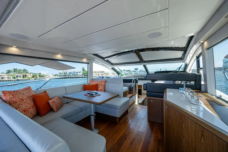 Slide: The Image of Luxurious interior of 2019 Sunseeker Predator 50 yacht with elegant seating and panoramic windows. - 29