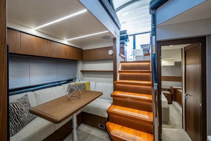 Slide: The Image of Luxurious interior of 2019 Sunseeker Predator 50 yacht with modern seating and wooden stairs. - 41