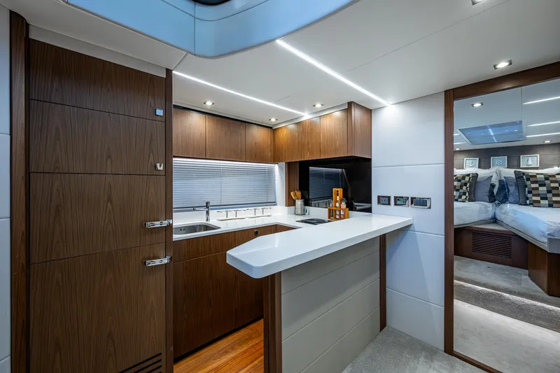 Slide: The Image of Luxurious interior of 2019 Sunseeker Predator 50 yacht with modern kitchen and bedroom. - 43