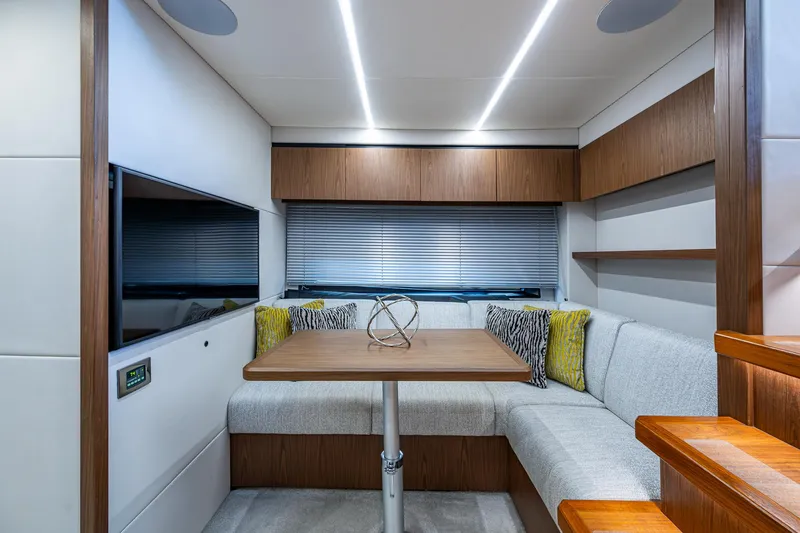 Slide: The Image of Luxurious interior of 2019 Sunseeker Predator 50 yacht with modern seating and table. - 44