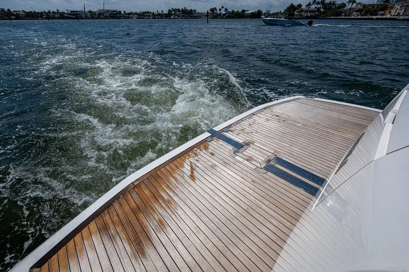 Slide: The Image of 2019 Sunseeker Predator 50 yacht deck with ocean view and wake. - 8