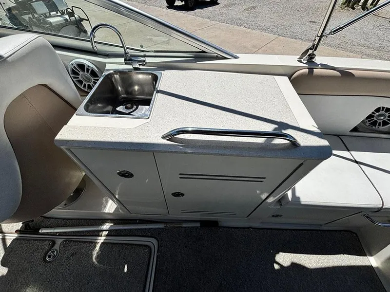 Slide: The Image of 2009 Sea Ray 290 Sundeck boat interior with sink and storage area. - 10