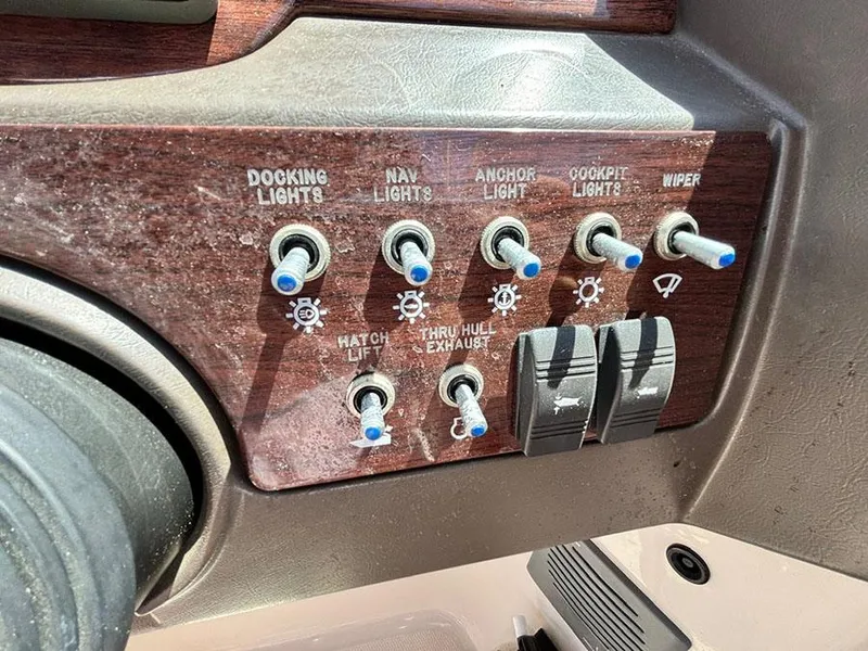 Slide: The Image of Control panel of a 2009 Sea Ray 290 Sundeck boat with labeled switches. - 18