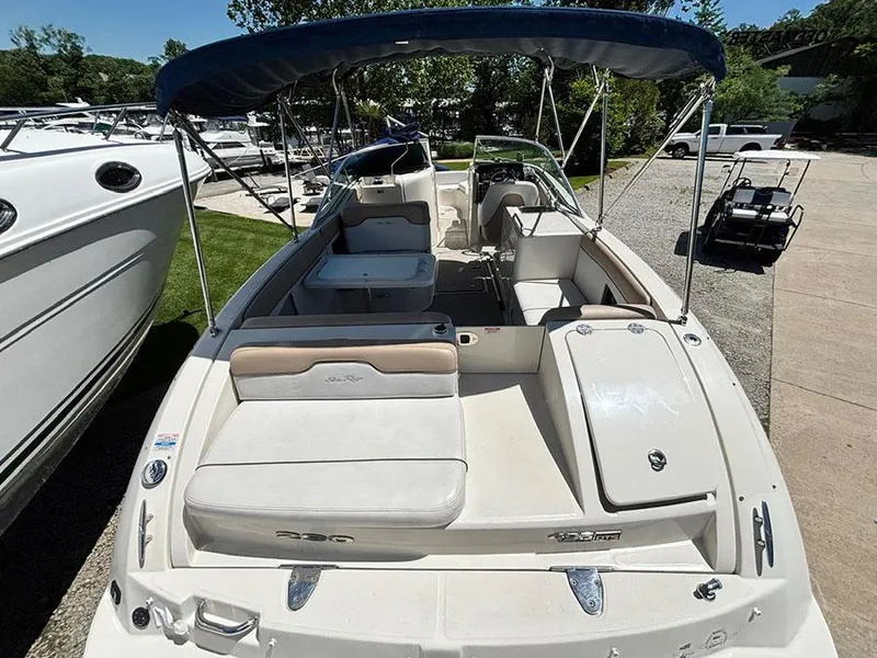 Slide: The Image of 2009 Sea Ray 290 Sundeck boat with canopy, docked outdoors. - 4