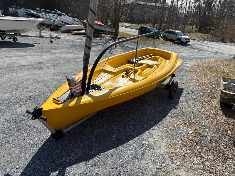 Slide: The Image of Yellow 2002 Captiva Escape sailboat on trailer in outdoor setting. - 3