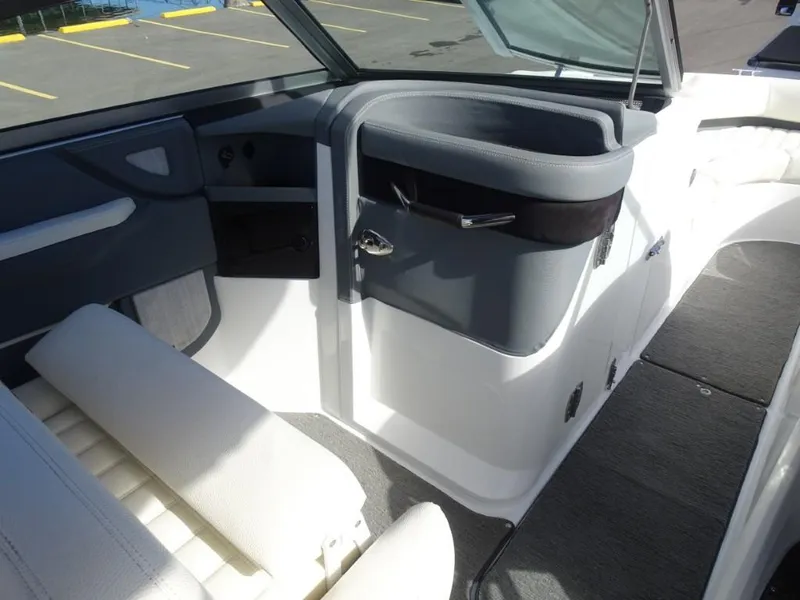 Slide: The Image of 2018 Cobalt R5 Surf boat interior with gray and white seating and dashboard. - 12