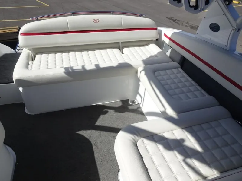 Slide: The Image of 2018 Cobalt R5 Surf boat interior with white cushioned seating and red accents. - 17