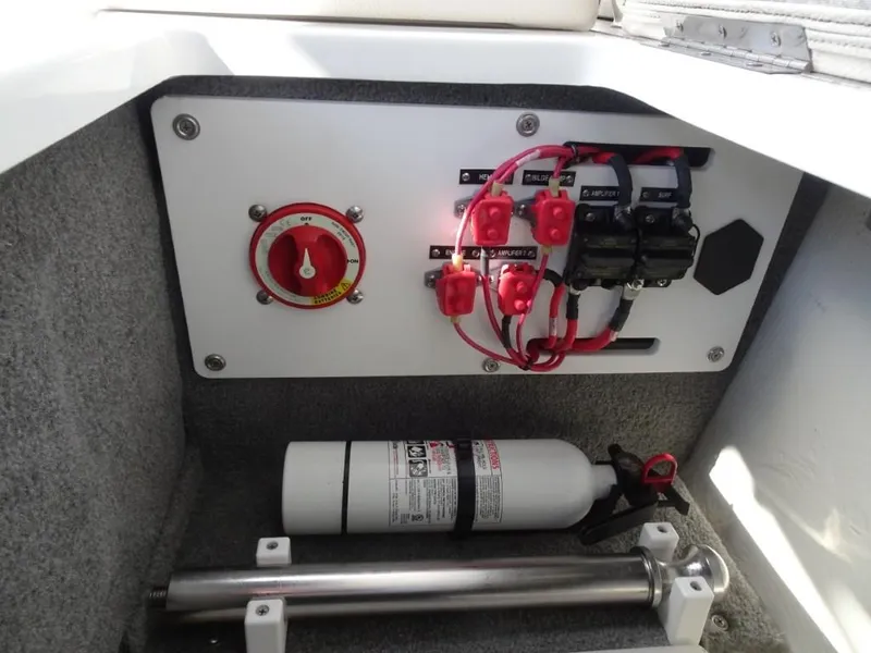 Slide: The Image of Electrical panel and fire extinguisher in 2018 Cobalt R5 Surf boat compartment. - 18