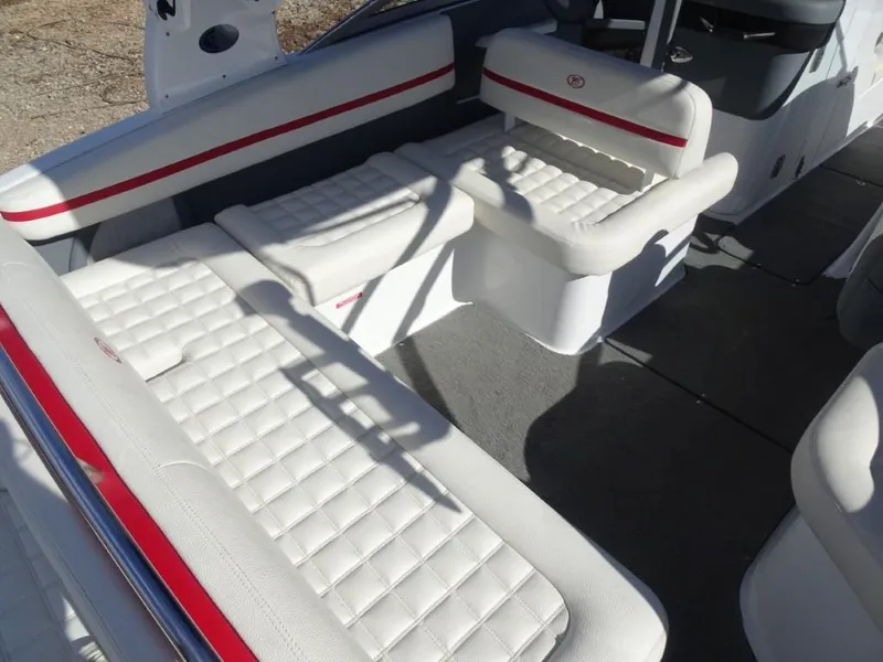 Slide: The Image of 2018 Cobalt R5 Surf boat interior with white quilted seating and red accents. - 6
