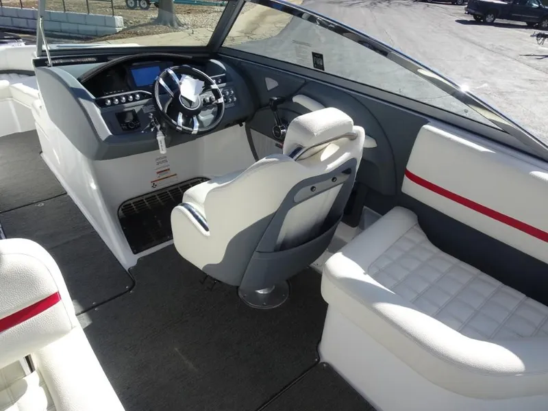 Slide: The Image of Interior of a 2018 Cobalt R5 Surf boat with modern steering and seating. - 7