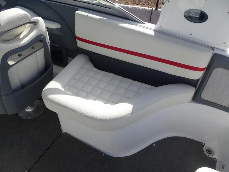 Slide: The Image of 2018 Cobalt R5 Surf boat interior with white cushioned seating and red accent stripe. - 8
