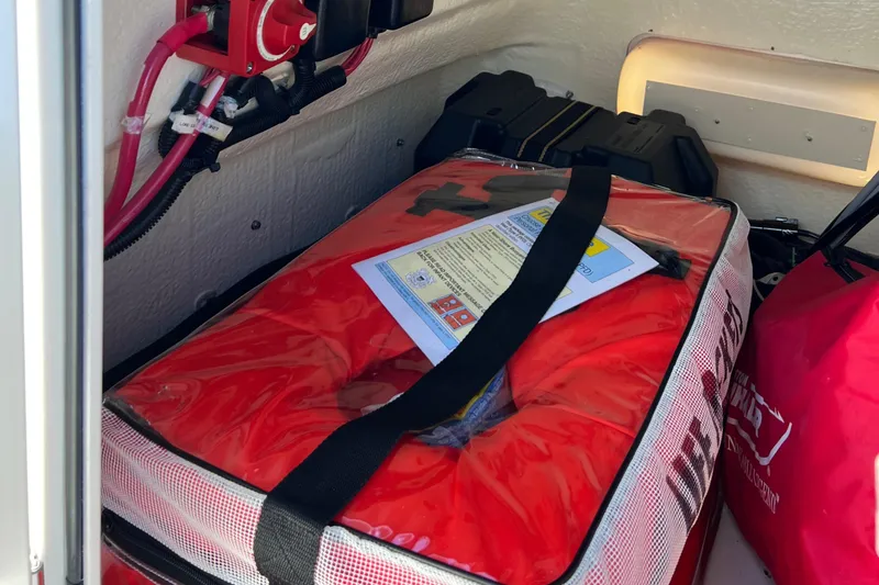 Slide: The Image of Safety equipment storage on 2022 Boston Whaler 190 Montauk boat. - 19