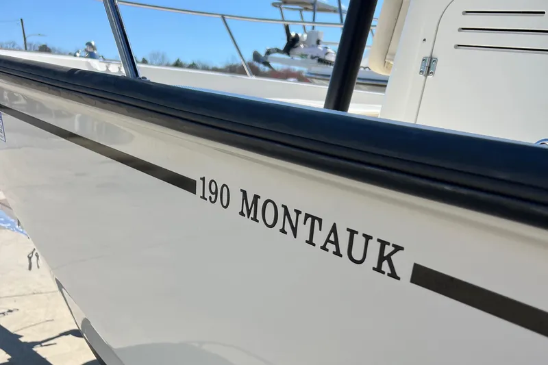 Slide: The Image of 2022 Boston Whaler 190 Montauk boat side view with model name visible. - 3