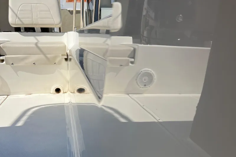 Slide: The Image of 2022 Boston Whaler 190 Montauk boat interior with seating and speaker detail. - 8