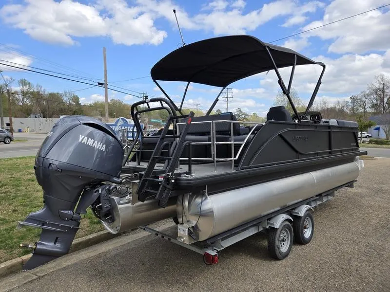 Slide: The Image of 2025 Godfrey Sweetwater 2286 SFLC pontoon boat with Yamaha engine on trailer. - 2