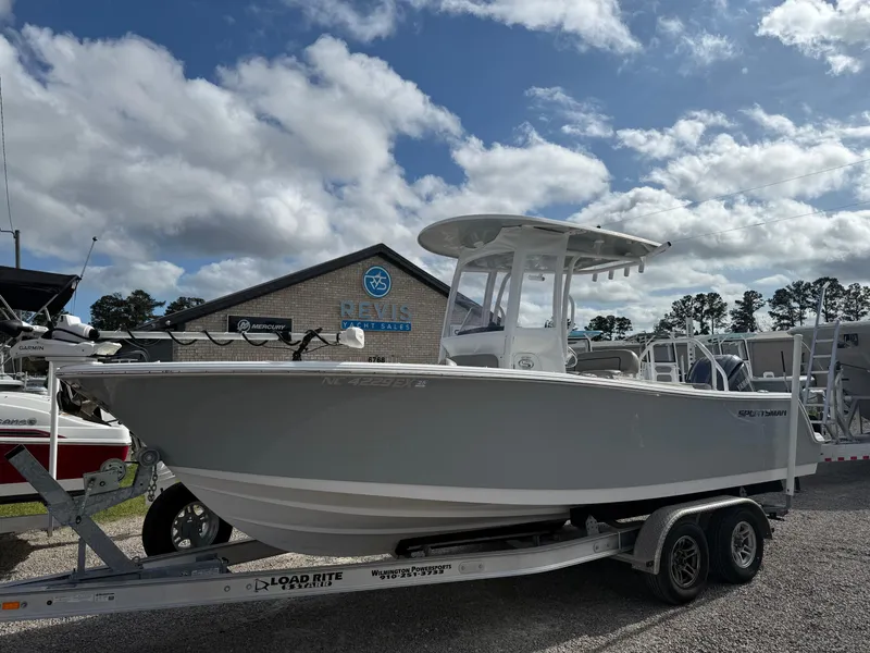 Slide: The Image of 2022 Sportsman Open 232 Center Console boat on trailer under cloudy sky. - 18