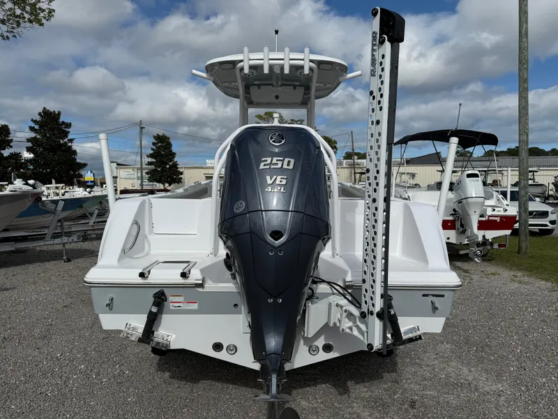 Slide: The Image of 2022 Sportsman Open 232 Center Console boat with Yamaha 250 V6 engine, parked outdoors. - 22
