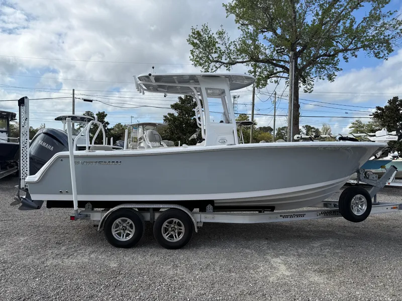 Slide: The Image of 2022 Sportsman Open 232 Center Console boat on trailer, parked outdoors. - 25