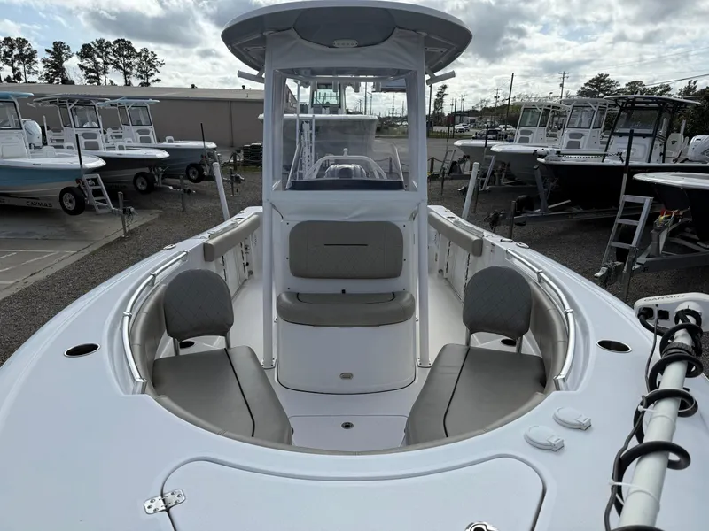 Slide: The Image of 2022 Sportsman Open 232 Center Console boat, docked, showcasing spacious seating and modern design. - 28