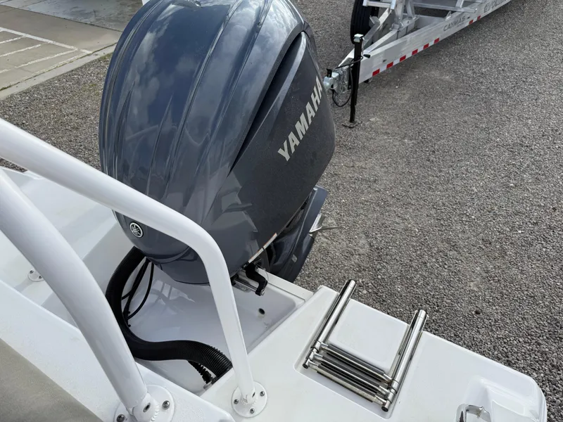 Slide: The Image of 2022 Sportsman Open 232 Center Console with Yamaha outboard motor and ladder. - 33