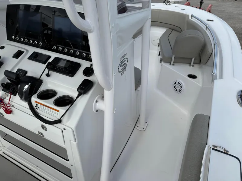 Slide: The Image of 2022 Sportsman Open 232 Center Console boat interior with modern dashboard and seating. - 34