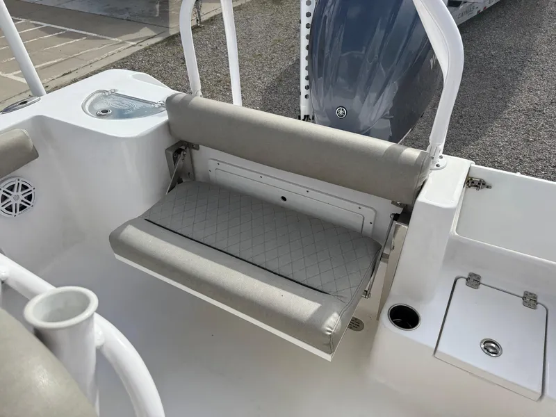 Slide: The Image of 2022 Sportsman Open 232 Center Console boat with foldable rear seat and storage. - 36