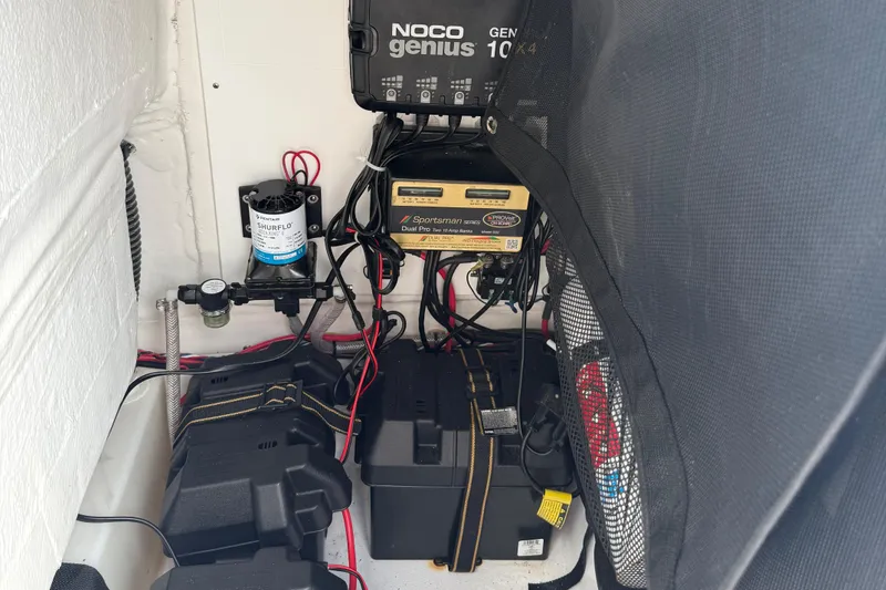 Slide: The Image of Electrical components inside a 2022 Sportsman Open 232 Center Console boat. - 38