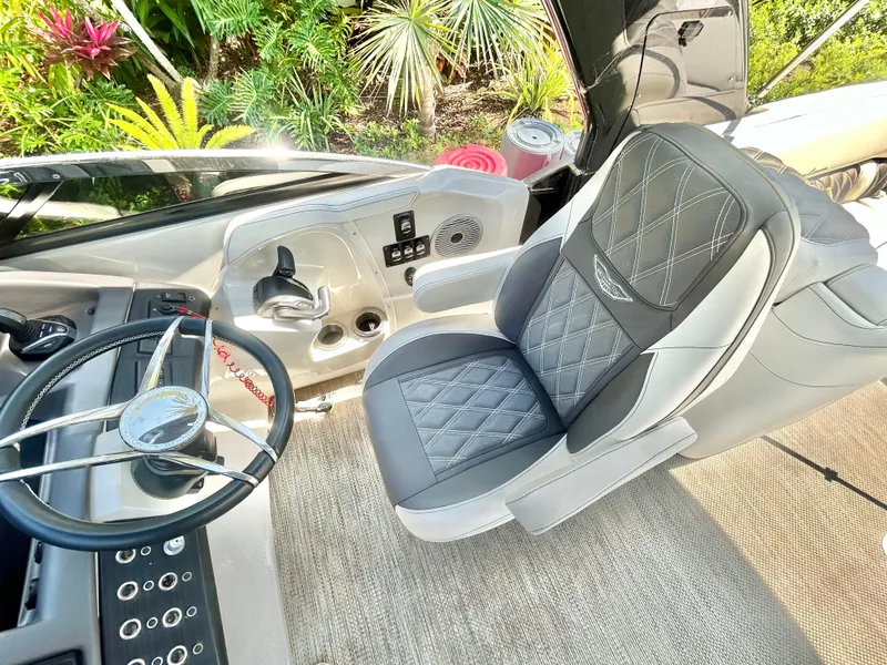 Slide: The Image of Luxurious interior of a 2021 Bennington 30 boat with plush seating and modern controls. - 11