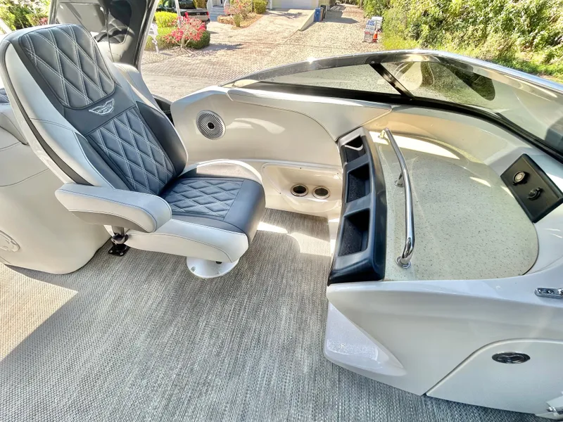 Slide: The Image of Luxurious interior of a 2021 Bennington 30 boat with plush seating and sleek dashboard. - 12