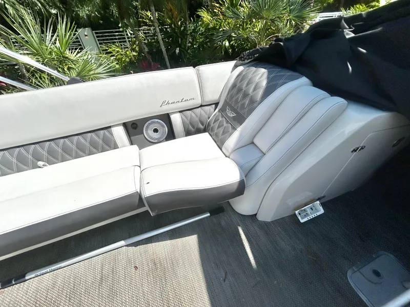 Slide: The Image of Luxurious seating on a 2021 Bennington 30 boat with quilted upholstery and speaker. - 17
