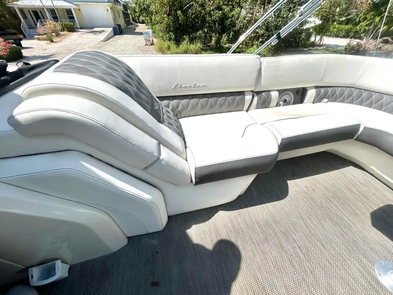 Slide: The Image of Luxurious seating on a 2021 Bennington 30 boat, featuring elegant upholstery and spacious design. - 18