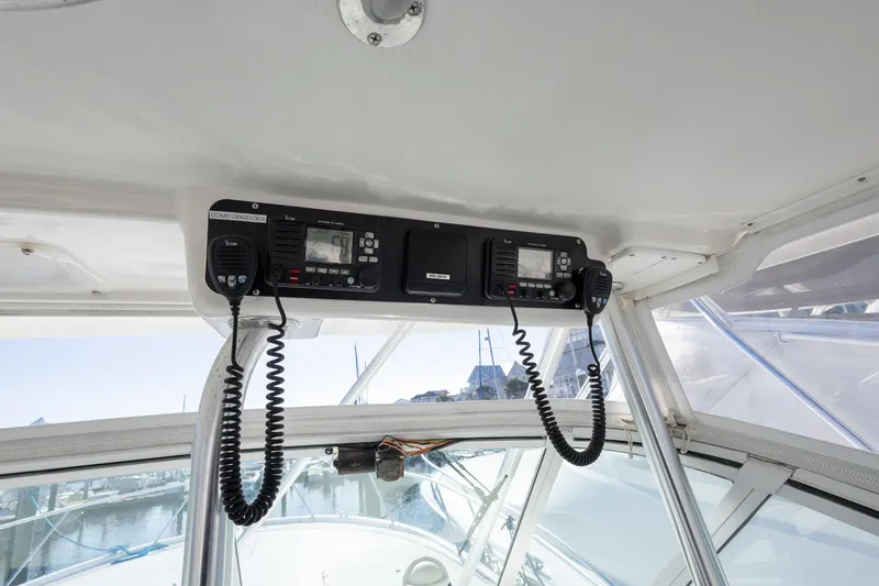 Slide: The Image of 2005 Luhrs 36 boat cockpit with communication equipment and clear windows. - 19