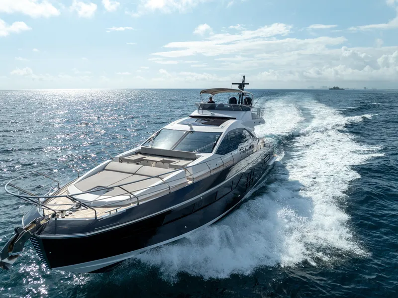 Slide: The Image of Luxurious 2019 Azimut S7 yacht cruising on open sea under clear skies. - 0