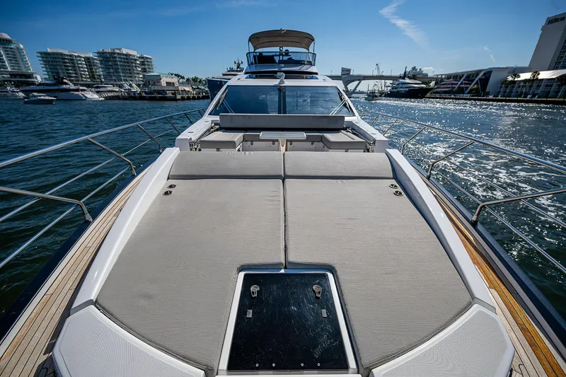 Slide: The Image of 2019 Azimut S7 yacht on water, showcasing spacious deck and modern design. - 14