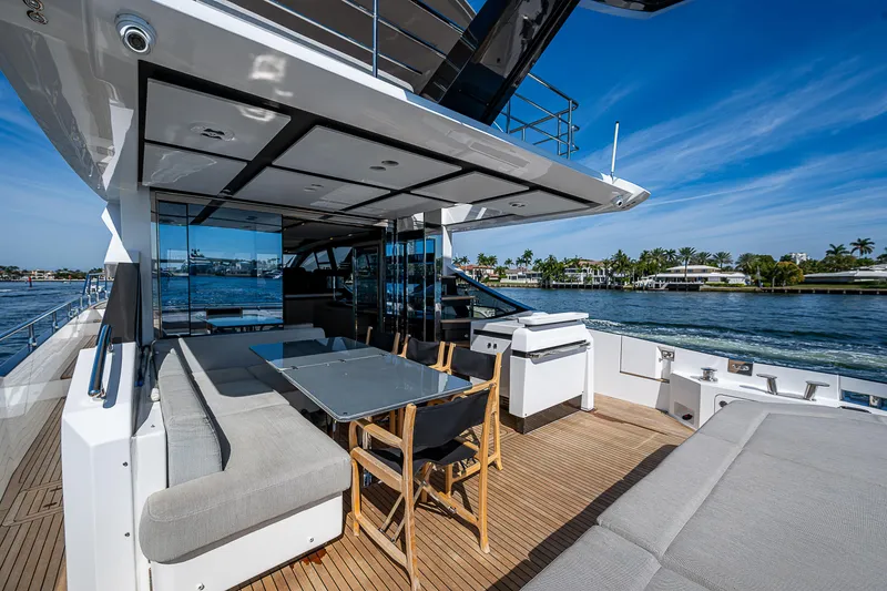 Slide: The Image of Luxurious 2019 Azimut S7 yacht deck with seating, table, and ocean view. - 21